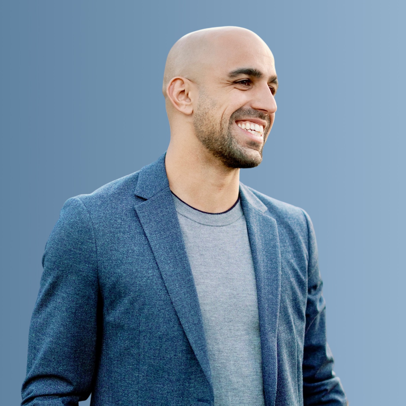 Kevin Hekmat smiling in a blue blazer